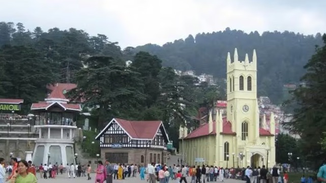 A traveler walking through different cities including Shimla, Hyderabad, and New Delhi